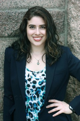 Dr. Lewin in professional dress with her hand on her hip.
